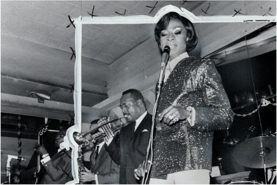 Black and White Photo of Jackie Shane singing in a sequin blazer, profile of a trumpet player playing behind her.